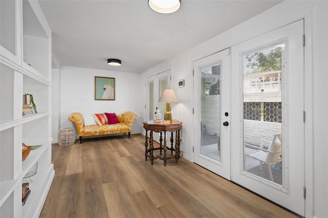 1594 Rue Calais, Bonne Terre, MO 63628 - doorway with french doors, wood finished floors, a textured ceiling, and baseboards