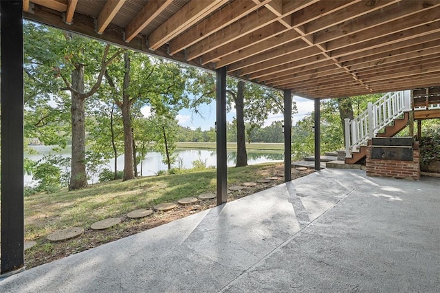 1594 Rue Calais, Bonne Terre, MO 63628 - view of patio / terrace featuring a water view, stairs, and view of scattered trees