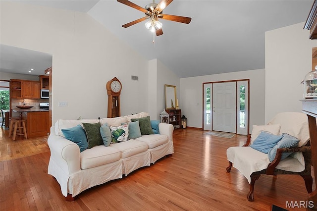 238 Skyway Dr, New Haven, MO 63068 - living room featuring high vaulted ceiling, a ceiling fan, and light wood-style floors