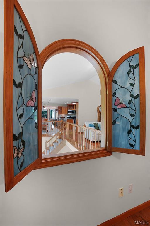 238 Skyway Dr, New Haven, MO 63068 - hallway featuring arched walkways and wood finished floors