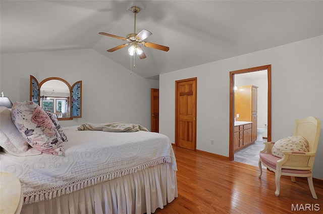 238 Skyway Dr, New Haven, MO 63068 - bedroom featuring light wood-type flooring, vaulted ceiling, ensuite bath, and ceiling fan