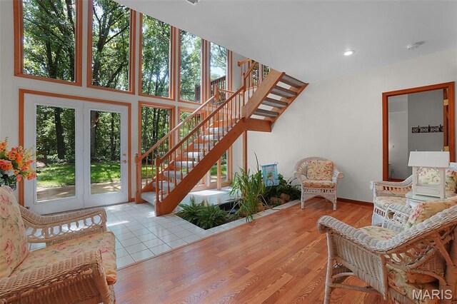 238 Skyway Dr, New Haven, MO 63068 - living room with stairs, recessed lighting, french doors, and wood finished floors
