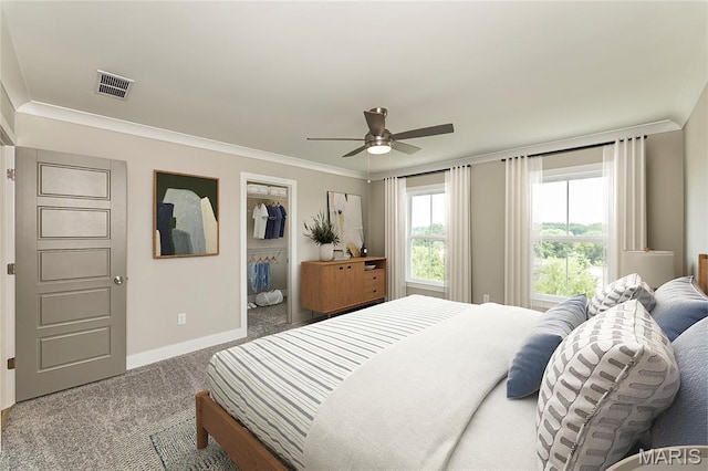 8919 E Gateway Hts Unit 94-804, Richmond Heights, MO 63144 - bedroom featuring carpet, crown molding, a ceiling fan, a walk in closet, and a closet
