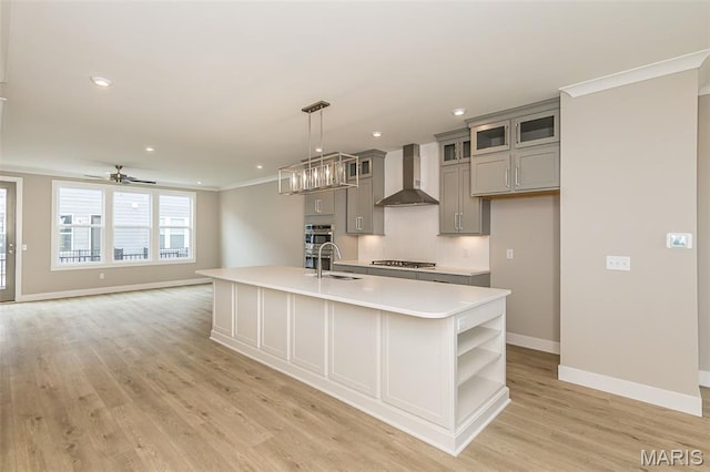 8919 E Gateway Hts Unit 94-804, Richmond Heights, MO 63144 - kitchen featuring gray cabinetry, wall chimney range hood, open shelves, light countertops, and light wood-style flooring