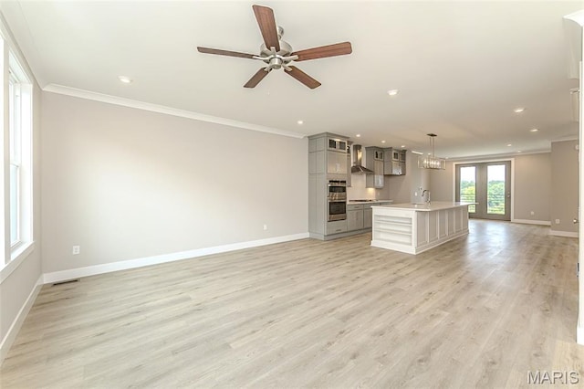 8919 E Gateway Hts Unit 94-804, Richmond Heights, MO 63144 - unfurnished living room featuring baseboards, a sink, crown molding, a ceiling fan, and recessed lighting