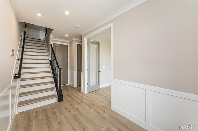 8919 E Gateway Hts Unit 94-804, Richmond Heights, MO 63144 - staircase featuring crown molding, wood finished floors, recessed lighting, and wainscoting
