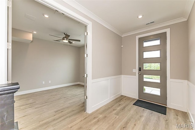 8919 E Gateway Hts Unit 94-804, Richmond Heights, MO 63144 - entryway featuring healthy amount of natural light, a wainscoted wall, ceiling fan, ornamental molding, and light wood-style floors