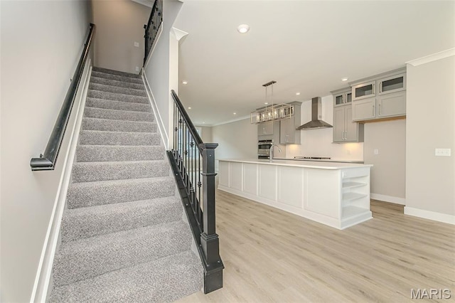 8919 E Gateway Hts Unit 94-804, Richmond Heights, MO 63144 - staircase featuring wood finished floors, baseboards, recessed lighting, and crown molding