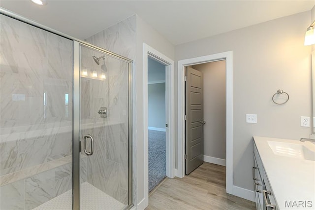 8919 E Gateway Hts Unit 94-804, Richmond Heights, MO 63144 - full bath featuring a shower stall, baseboards, vanity, wood finished floors, and recessed lighting