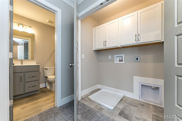 8919 E Gateway Hts Unit 94-804, Richmond Heights, MO 63144 - laundry area with cabinet space, hookup for an electric dryer, washer hookup, and baseboards