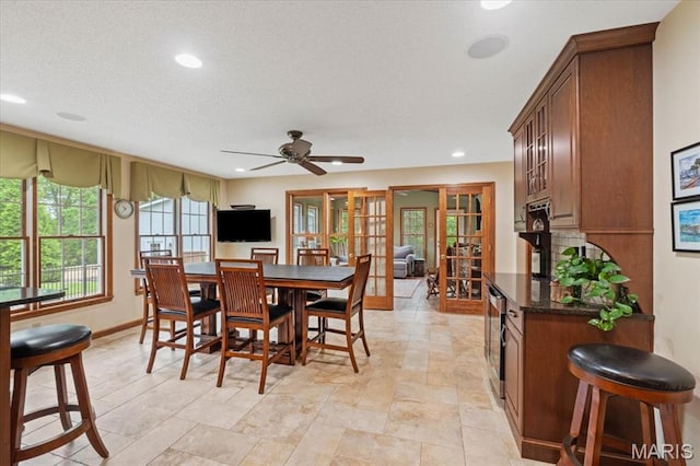 22 Fox Valley Ct, Lake St Louis, MO 63367 - dining area featuring recessed lighting, ceiling fan, baseboards, french doors, and light stone finish floors