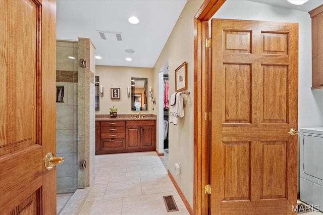 22 Fox Valley Ct, Lake St Louis, MO 63367 - hall with washer / dryer, a sink, and recessed lighting