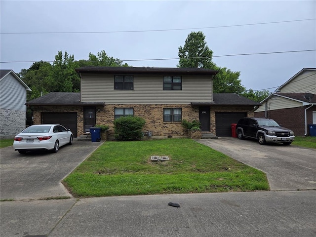 1023 NE Village Ln NE, Cape Girardeau, MO 63701 - view of front of house featuring an attached garage, concrete driveway, and a front lawn