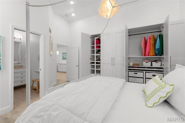 1021 Kilderkin Way, Saint Charles, MO 63301 - bedroom featuring wood finished floors, recessed lighting, and connected bathroom