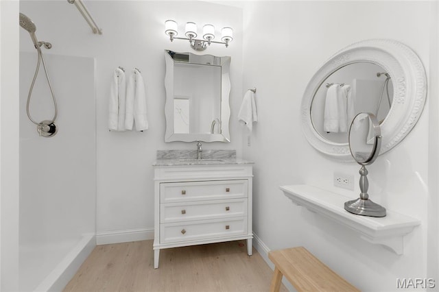 1021 Kilderkin Way, Saint Charles, MO 63301 - bathroom with wood finished floors, a shower, and vanity