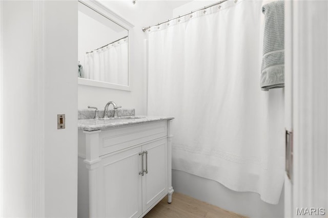 1021 Kilderkin Way, Saint Charles, MO 63301 - full bathroom with vanity, shower / tub combo, and wood finished floors
