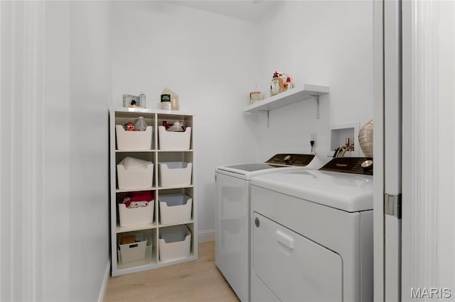 1021 Kilderkin Way, Saint Charles, MO 63301 - laundry area with washing machine and dryer and light wood-type flooring