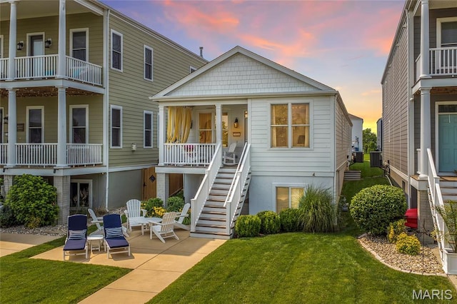 1021 Kilderkin Way, Saint Charles, MO 63301 - back of house featuring a lawn, stairway, and a patio