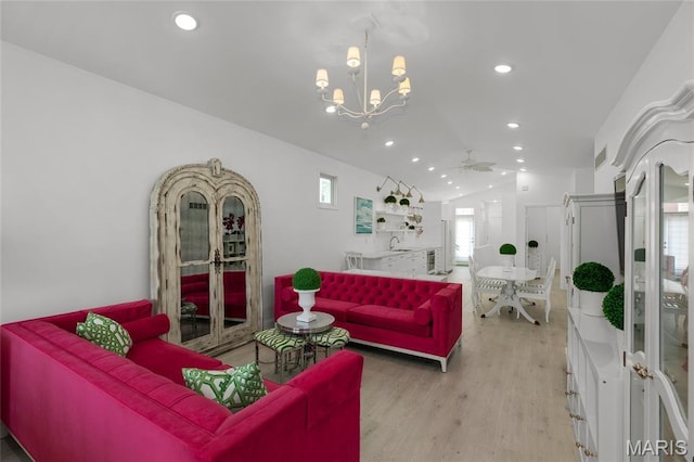 1021 Kilderkin Way, Saint Charles, MO 63301 - living room featuring recessed lighting, light wood-style floors, vaulted ceiling, a chandelier, and ceiling fan