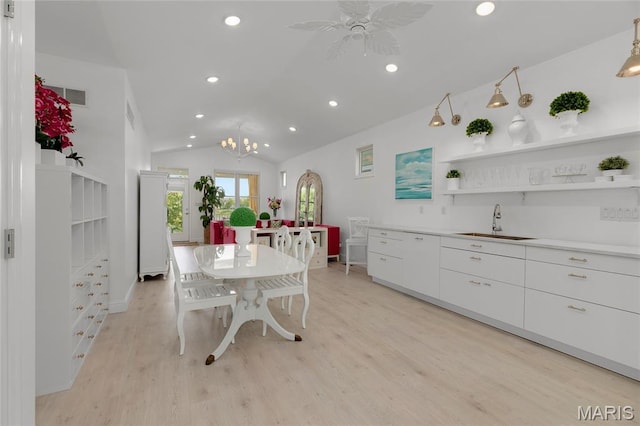 1021 Kilderkin Way, Saint Charles, MO 63301 - dining area featuring vaulted ceiling, light wood-style floors, recessed lighting, ceiling fan, and a chandelier