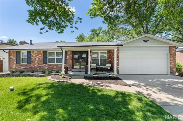2774 Ashrock Dr, Saint Louis, MO 63129 - ranch-style home with a garage, concrete driveway, a front lawn, brick siding, and french doors