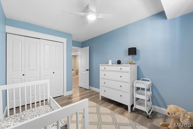 2774 Ashrock Dr, Saint Louis, MO 63129 - bedroom with baseboards, wood finished floors, a closet, and a ceiling fan