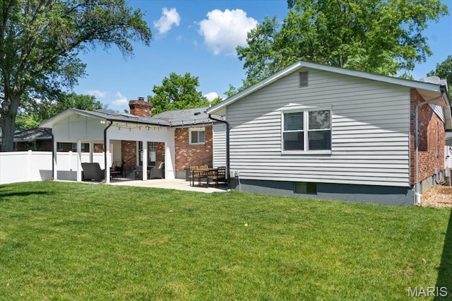 2774 Ashrock Dr, Saint Louis, MO 63129 - rear view of property featuring brick siding, a patio area, and a chimney