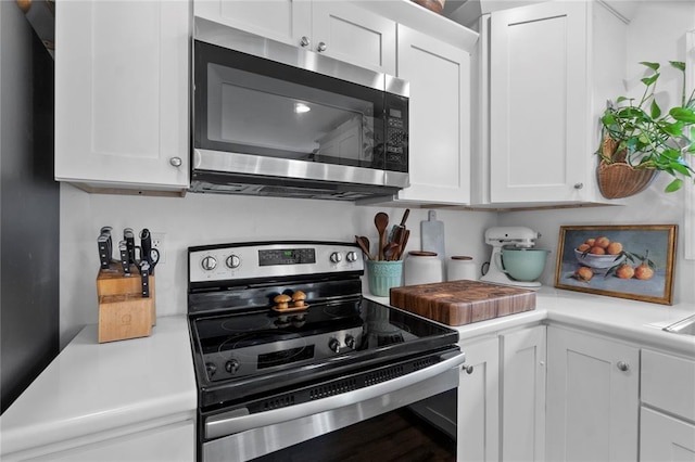 170 Parklane Dr, Cape Girardeau, MO 63701 - kitchen with appliances with stainless steel finishes, light countertops, and white cabinetry
