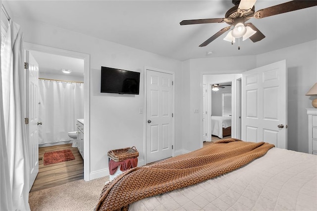 170 Parklane Dr, Cape Girardeau, MO 63701 - bedroom featuring baseboards, ensuite bath, ceiling fan, and light colored carpet