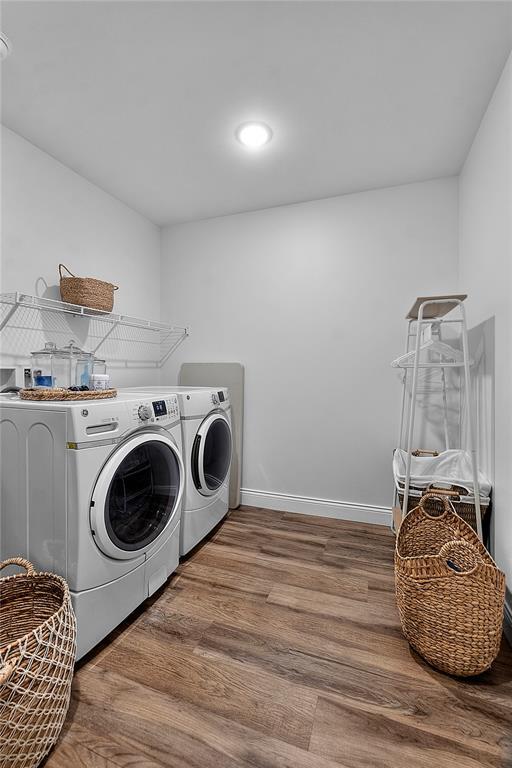 170 Parklane Dr, Cape Girardeau, MO 63701 - laundry room featuring washing machine and dryer, wood finished floors, baseboards, and recessed lighting