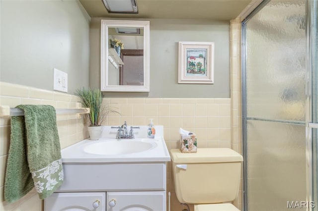 4319 Sinnwell Dr, Saint Louis, MO 63123 - bathroom with vanity, a shower with door, and tile walls