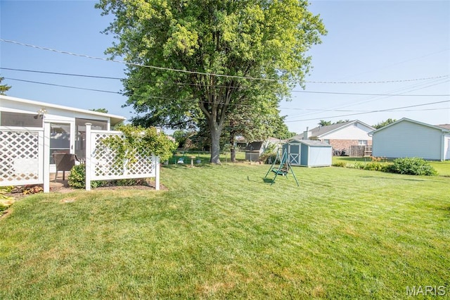 4319 Sinnwell Dr, Saint Louis, MO 63123 - view of yard with a storage unit and a sunroom