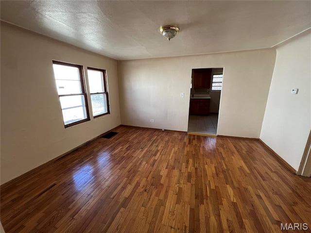 10052 Valley Dr, Riverview, MO 63137 - unfurnished room featuring wood finished floors and baseboards