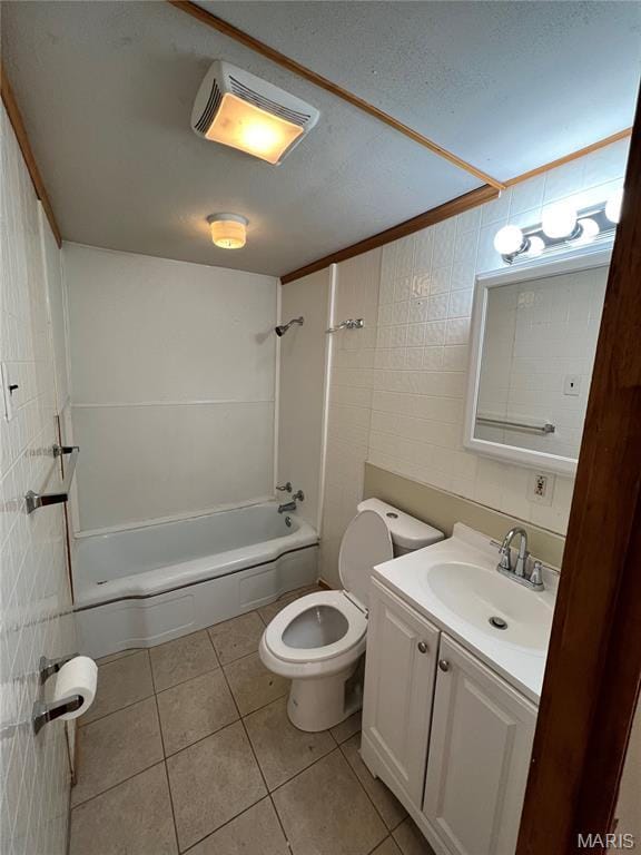 10052 Valley Dr, Riverview, MO 63137 - bathroom featuring vanity, toilet, tile patterned floors, bathtub / shower combination, and a textured ceiling