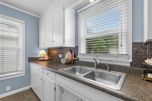 1545 N Main St, Cape Girardeau, MO 63701 - kitchen featuring a sink, dark countertops, tasteful backsplash, plenty of natural light, and ornamental molding