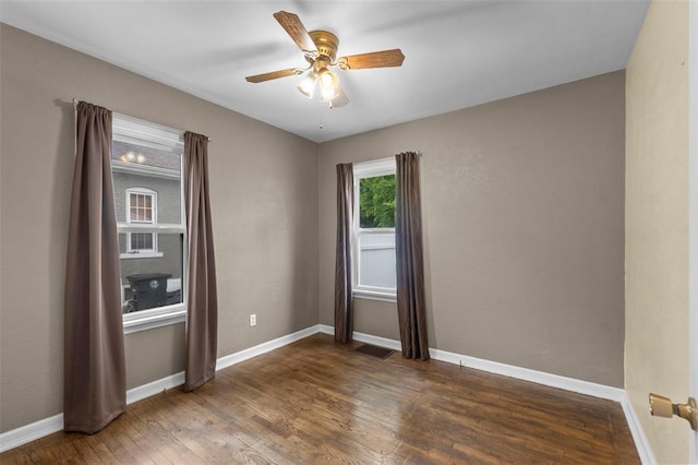 1545 N Main St, Cape Girardeau, MO 63701 - spare room with wood finished floors, a ceiling fan, and baseboards
