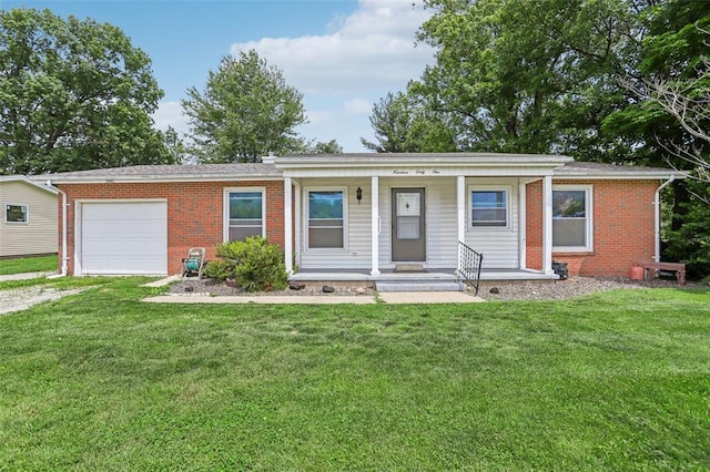 1961 E Union Ave, Litchfield, IL 62056 - ranch-style house with an attached garage, a porch, brick siding, dirt driveway, and a front yard