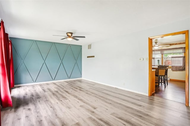 1961 E Union Ave, Litchfield, IL 62056 - spare room featuring ceiling fan, wood finished floors, and baseboards