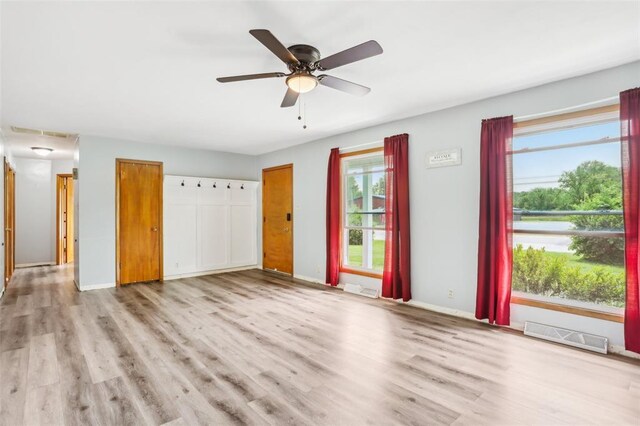 1961 E Union Ave, Litchfield, IL 62056 - unfurnished living room with wood finished floors, baseboards, and a ceiling fan