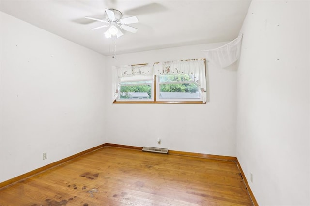 1961 E Union Ave, Litchfield, IL 62056 - unfurnished room with a ceiling fan, wood finished floors, and baseboards