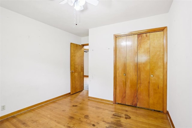 1961 E Union Ave, Litchfield, IL 62056 - unfurnished bedroom featuring wood finished floors, baseboards, ceiling fan, and a closet