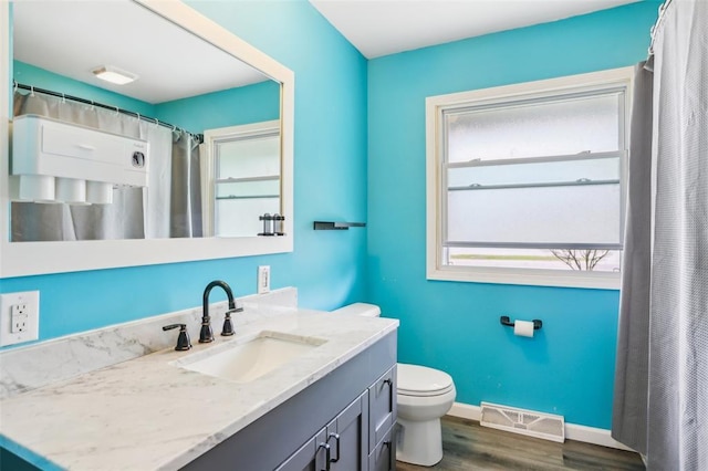 1961 E Union Ave, Litchfield, IL 62056 - bathroom featuring toilet, wood finished floors, vanity, and baseboards