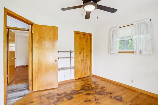 1961 E Union Ave, Litchfield, IL 62056 - unfurnished bedroom featuring wood finished floors, baseboards, and ceiling fan