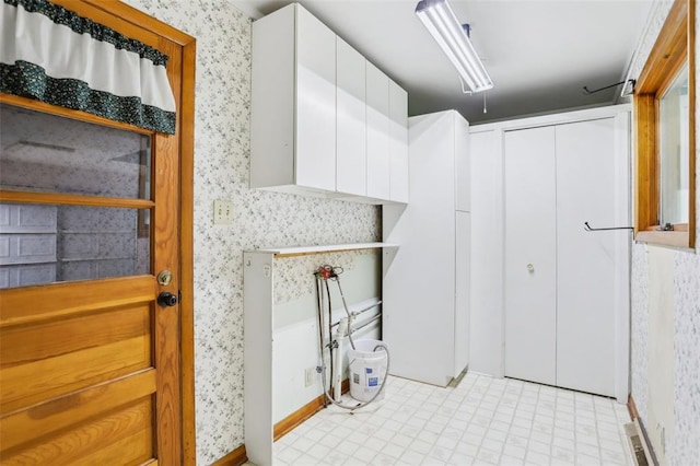 1961 E Union Ave, Litchfield, IL 62056 - laundry room featuring wallpapered walls and light tile patterned flooring