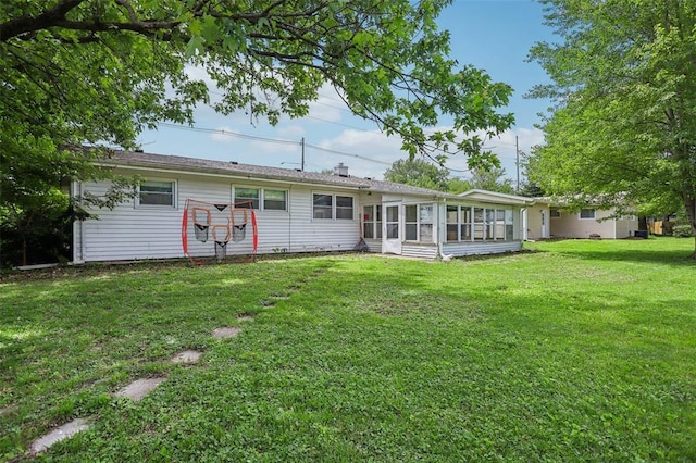 1961 E Union Ave, Litchfield, IL 62056 - back of house with a sunroom and a lawn