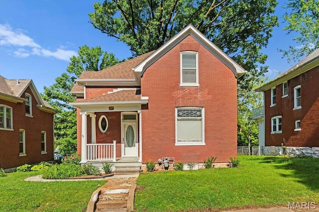 207 Voss Pl, Belleville, IL 62220 - traditional-style house featuring brick siding and a front lawn