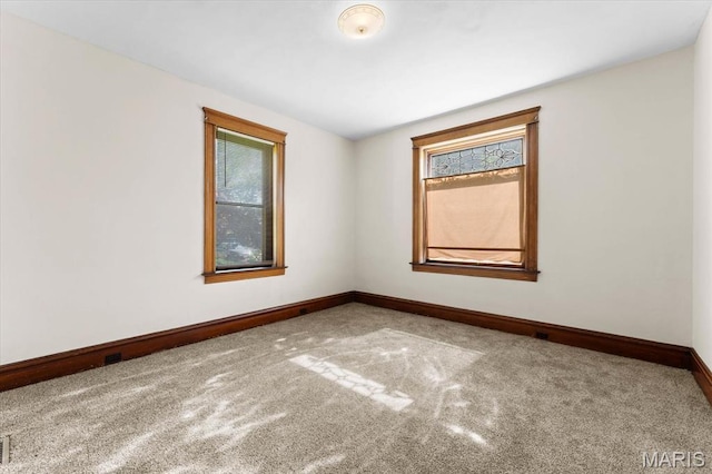 207 Voss Pl, Belleville, IL 62220 - carpeted empty room featuring plenty of natural light and baseboards