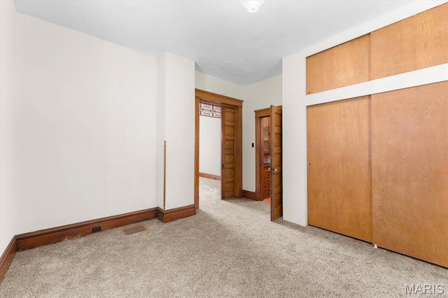 207 Voss Pl, Belleville, IL 62220 - unfurnished bedroom featuring carpet floors, a closet, and baseboards