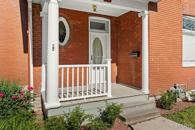 207 Voss Pl, Belleville, IL 62220 - doorway to property featuring covered porch and brick siding