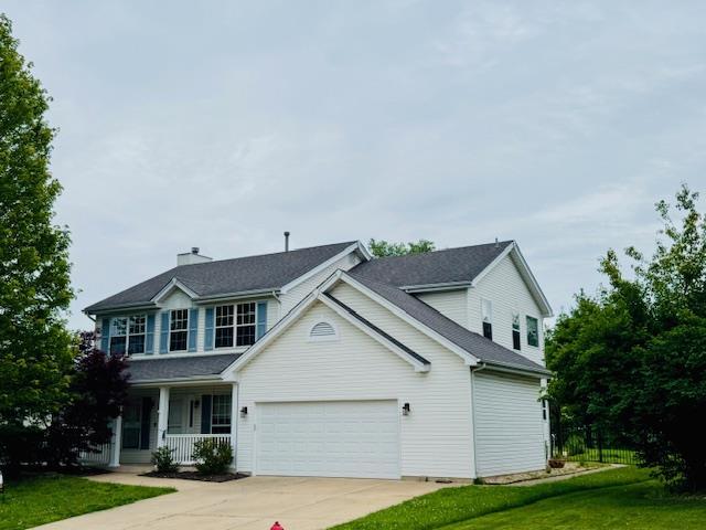 122 Tennessee Walker Way, Saint Peters, MO 63376 - traditional home with covered porch, a garage, and concrete driveway